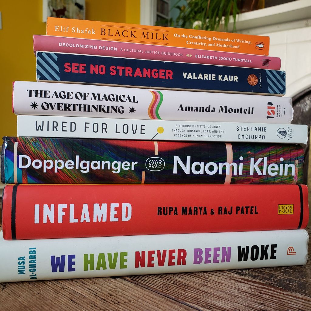 A stack of books with brightly coloured spines.